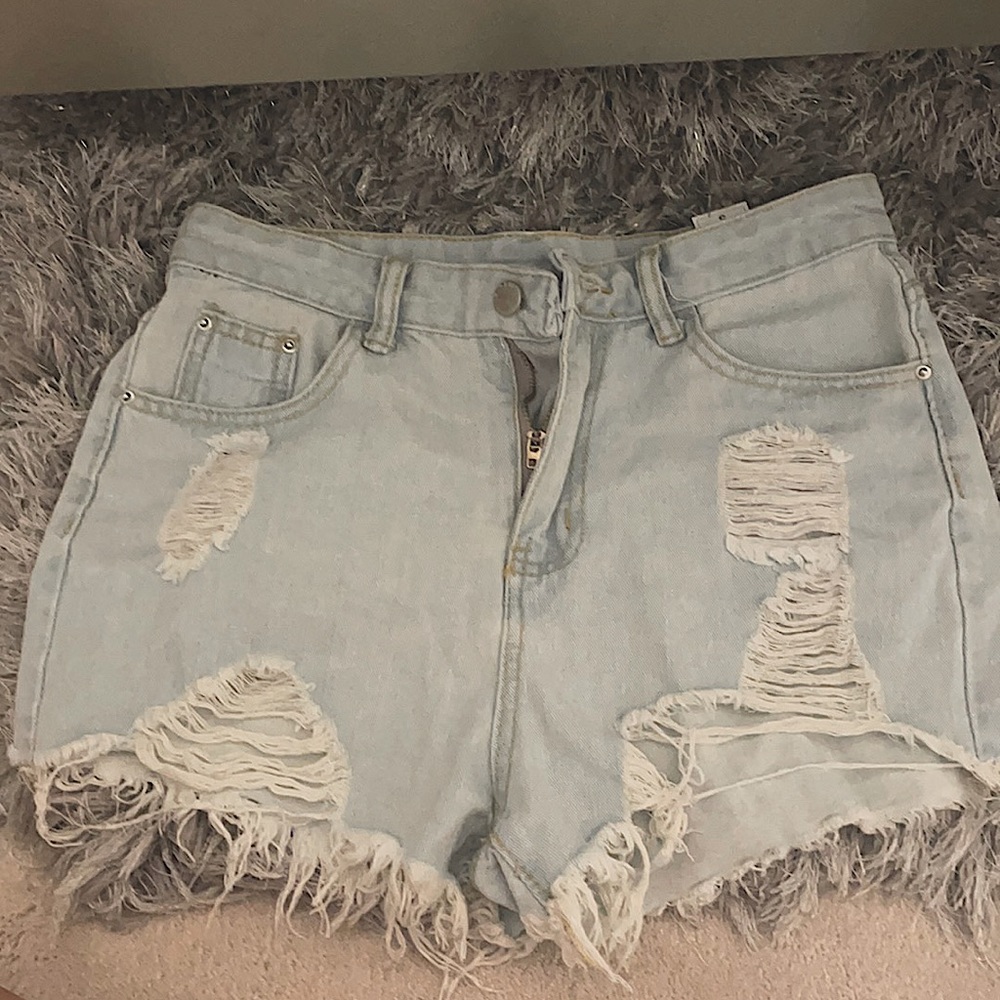 Ripped light wash jean shorts